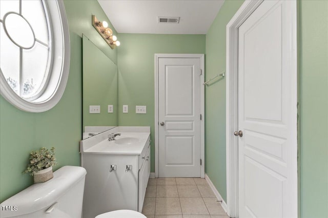 7856 Spungold St, Raleigh, NC 27617 - bathroom with vanity and tile patterned flooring