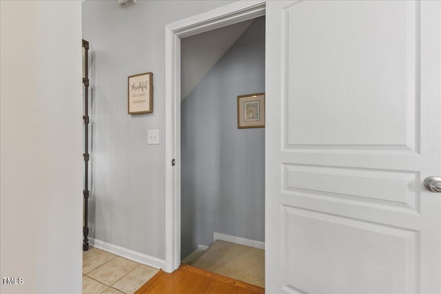 7856 Spungold St, Raleigh, NC 27617 - hallway with baseboards and light tile patterned floors
