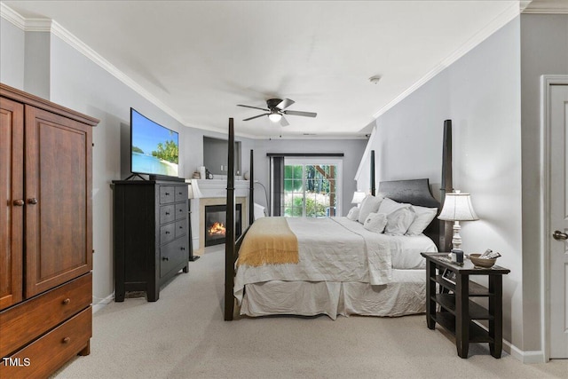7856 Spungold St, Raleigh, NC 27617 - bedroom featuring light carpet, ornamental molding, a glass covered fireplace, and a ceiling fan