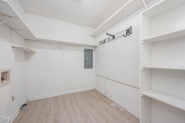 816 Kimpton Ct, Fuquay Varina, NC 27526 - laundry room featuring washer hookup, wood finished floors, and electric panel