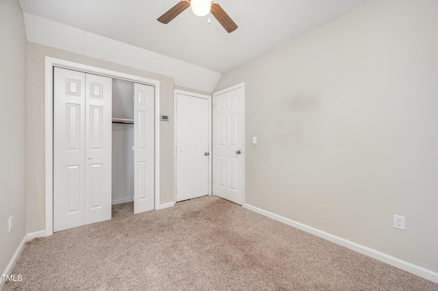 816 Kimpton Ct, Fuquay Varina, NC 27526 - unfurnished bedroom featuring light colored carpet, vaulted ceiling, and a ceiling fan