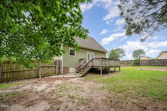 816 Kimpton Ct, Fuquay Varina, NC 27526 - rear view of property featuring a deck, a fenced backyard, roof with shingles, and a gate