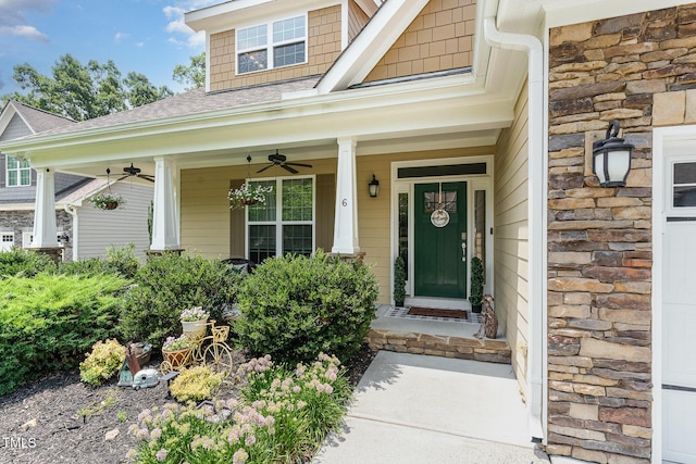 6 Tulip Tree Ct, Durham, NC 27712 - entrance to property featuring a ceiling fan, stone siding, a shingled roof, and a porch