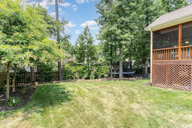 6 Tulip Tree Ct, Durham, NC 27712 - view of yard with a trampoline and a sunroom
