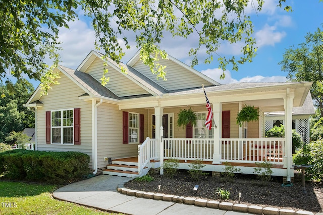 86 Basswood Cir, Willow Springs, NC 27592 - view of front of house featuring a porch and a shingled roof