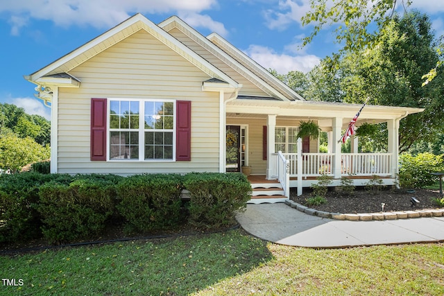 86 Basswood Cir, Willow Springs, NC 27592 - view of front of home featuring covered porch and a front lawn