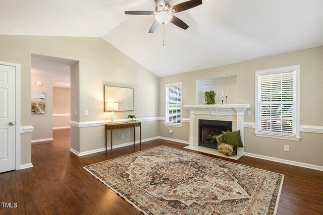 86 Basswood Cir, Willow Springs, NC 27592 - living area featuring a ceiling fan, lofted ceiling, wood finished floors, and a fireplace with flush hearth