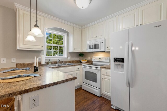 86 Basswood Cir, Willow Springs, NC 27592 - kitchen with white appliances, dark countertops, dark wood finished floors, decorative light fixtures, and white cabinets