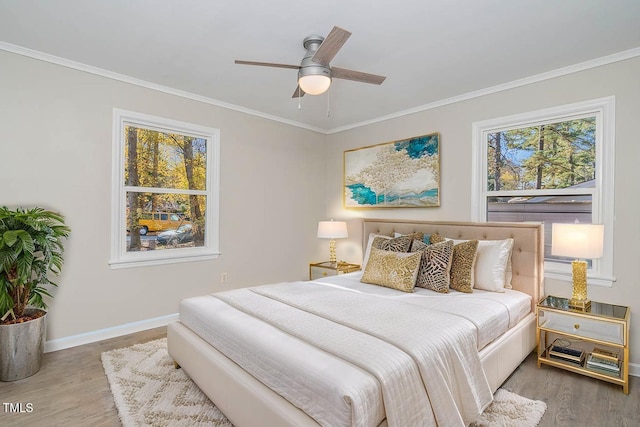 5917 Meadowlark Ln, Raleigh, NC 27610 - bedroom with ornamental molding, wood finished floors, and ceiling fan