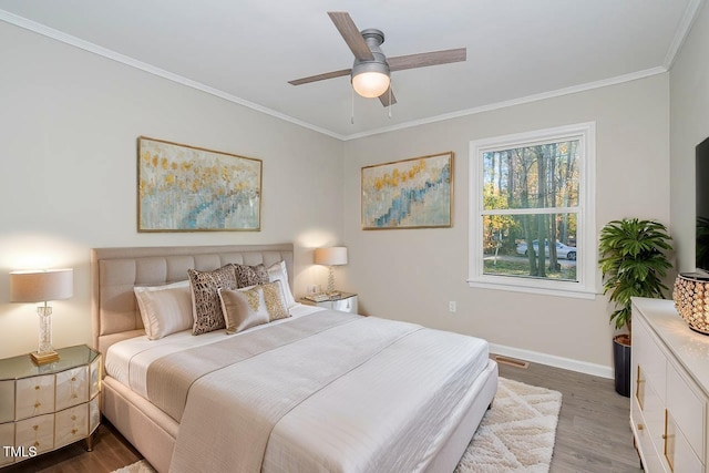 5917 Meadowlark Ln, Raleigh, NC 27610 - bedroom featuring crown molding, wood finished floors, and a ceiling fan