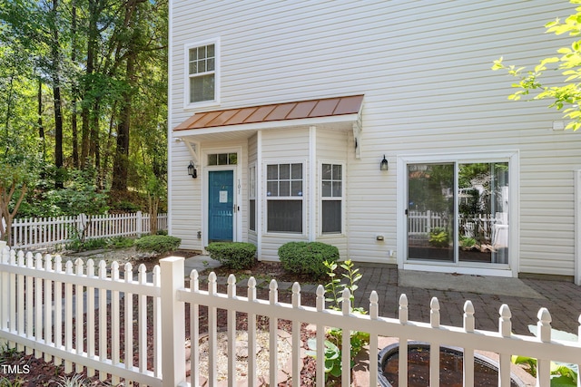 11710 Mezzanine Dr Unit 101, Raleigh, NC 27614 - doorway to property with a standing seam roof and a metal roof