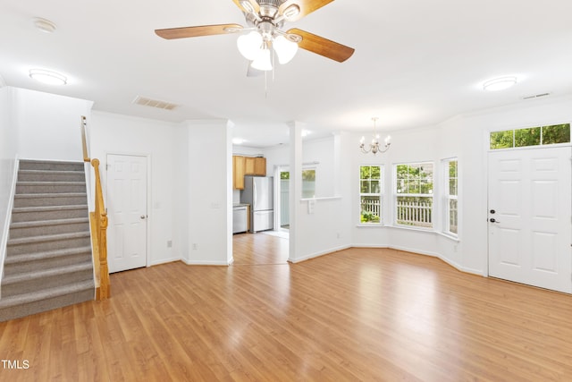 11710 Mezzanine Dr Unit 101, Raleigh, NC 27614 - unfurnished living room with stairs, light wood finished floors, a ceiling fan, a chandelier, and crown molding