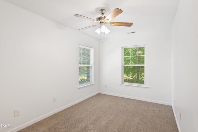 11710 Mezzanine Dr Unit 101, Raleigh, NC 27614 - carpeted empty room with baseboards and a ceiling fan