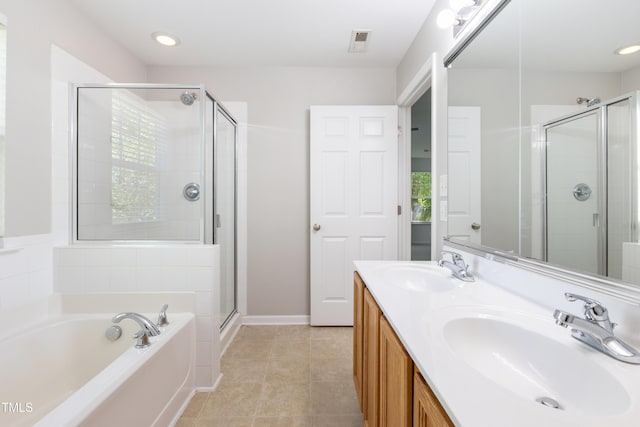 11710 Mezzanine Dr Unit 101, Raleigh, NC 27614 - full bath featuring a shower stall, a garden tub, double vanity, and tile patterned flooring