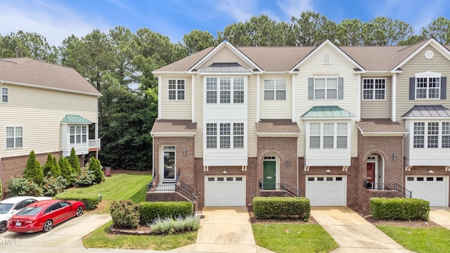 5503 Silver Moon Ln, Raleigh, NC 27606 - view of front of house with brick siding, driveway, a shingled roof, and an attached garage