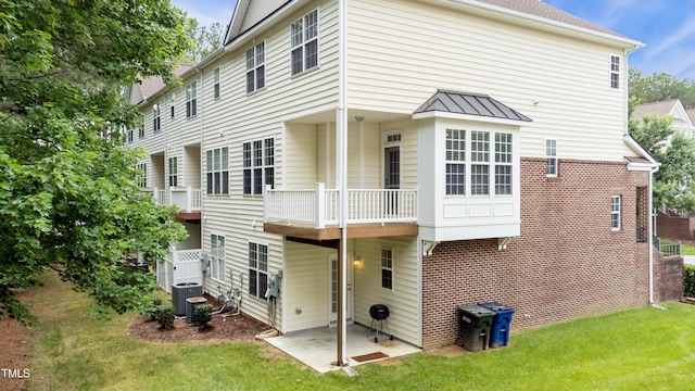 5503 Silver Moon Ln, Raleigh, NC 27606 - back of property featuring a yard and a patio