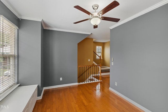 5503 Silver Moon Ln, Raleigh, NC 27606 - unfurnished room with ornamental molding, ceiling fan, and wood finished floors