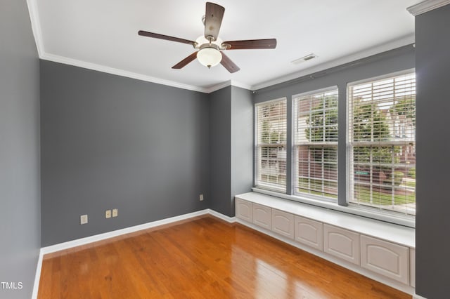 5503 Silver Moon Ln, Raleigh, NC 27606 - unfurnished room with wood finished floors, a ceiling fan, and ornamental molding