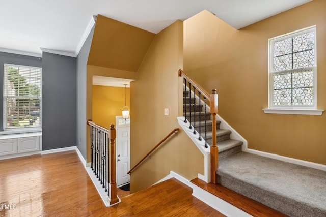 5503 Silver Moon Ln, Raleigh, NC 27606 - stairs with wood finished floors and crown molding