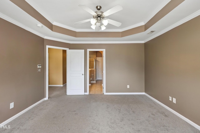 5503 Silver Moon Ln, Raleigh, NC 27606 - unfurnished bedroom featuring a tray ceiling, carpet floors, ornamental molding, and a ceiling fan
