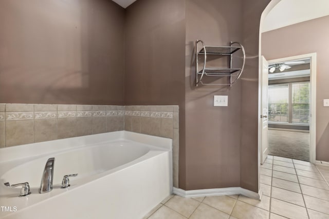 5503 Silver Moon Ln, Raleigh, NC 27606 - bathroom with a garden tub and tile patterned floors