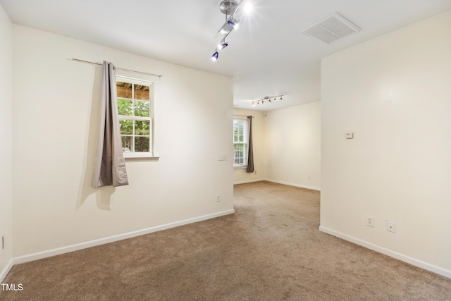 5503 Silver Moon Ln, Raleigh, NC 27606 - spare room with track lighting and carpet