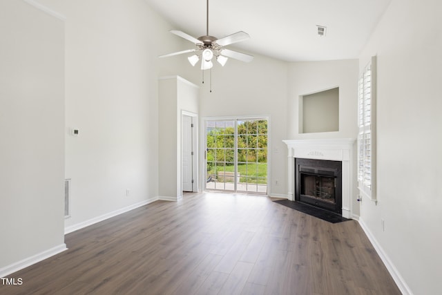 15 Canary Ct, Durham, NC 27713 - unfurnished living room with a fireplace with flush hearth, high vaulted ceiling, dark wood-style flooring, and ceiling fan