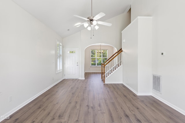 15 Canary Ct, Durham, NC 27713 - entrance foyer featuring high vaulted ceiling, wood finished floors, arched walkways, stairway, and ceiling fan