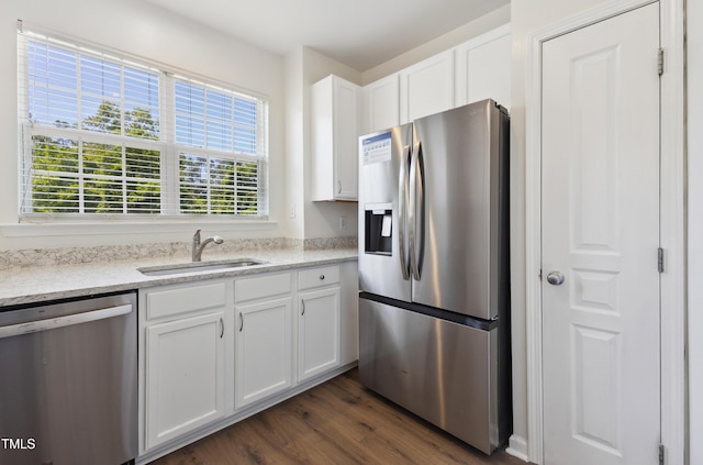 15 Canary Ct, Durham, NC 27713 - kitchen featuring stainless steel appliances, white cabinets, dark wood-style floors, and light stone countertops
