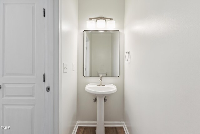 15 Canary Ct, Durham, NC 27713 - bathroom with baseboards and wood finished floors