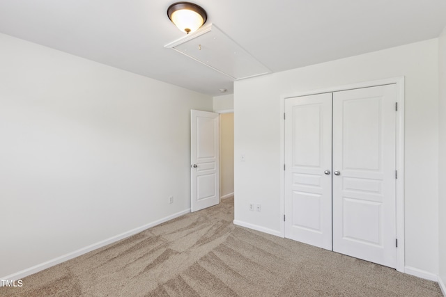 15 Canary Ct, Durham, NC 27713 - unfurnished bedroom with attic access, carpet flooring, and a closet
