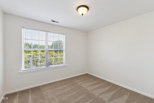 15 Canary Ct, Durham, NC 27713 - spare room with carpet flooring and baseboards