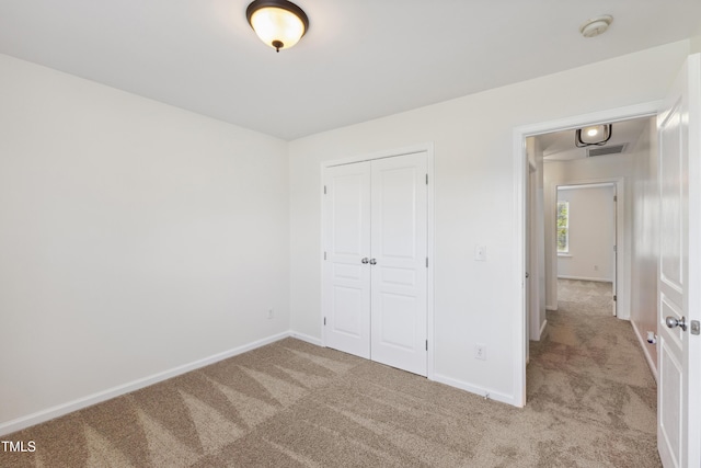 15 Canary Ct, Durham, NC 27713 - unfurnished bedroom featuring carpet flooring and a closet