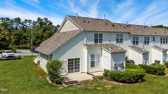 15 Canary Ct, Durham, NC 27713 - back of house with a lawn, a patio, and roof with shingles