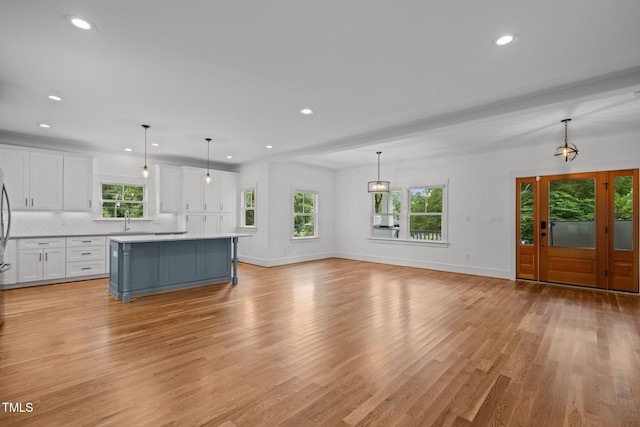 2551 Drake Ave, Durham, NC 27705 - unfurnished living room featuring light wood-type flooring and recessed lighting
