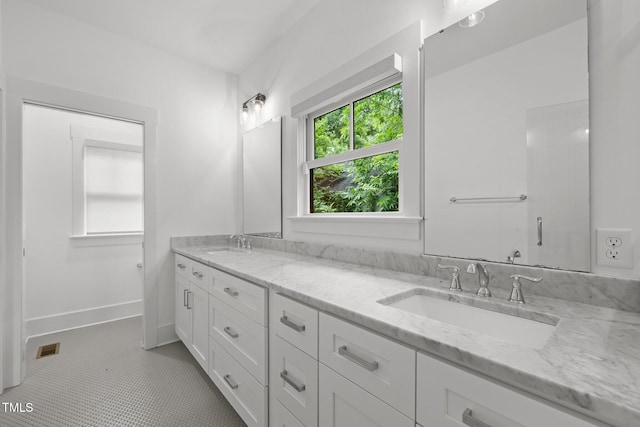 2551 Drake Ave, Durham, NC 27705 - bathroom featuring double vanity and tile patterned floors