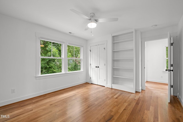 2551 Drake Ave, Durham, NC 27705 - unfurnished bedroom with wood finished floors, ceiling fan, and a closet