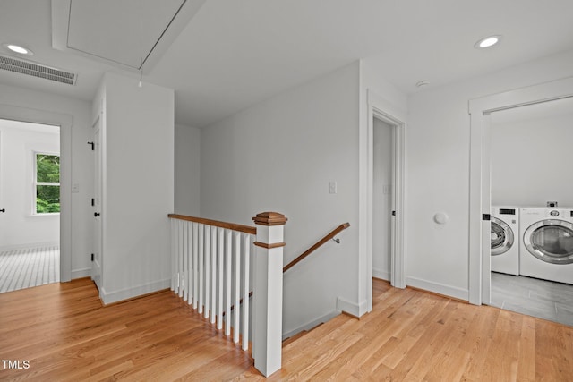 2551 Drake Ave, Durham, NC 27705 - corridor featuring attic access, an upstairs landing, separate washer and dryer, light wood-style floors, and recessed lighting