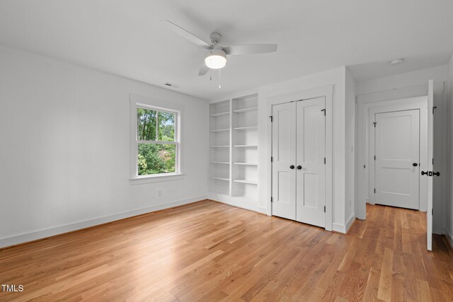 2551 Drake Ave, Durham, NC 27705 - unfurnished bedroom with light wood finished floors, a closet, and a ceiling fan