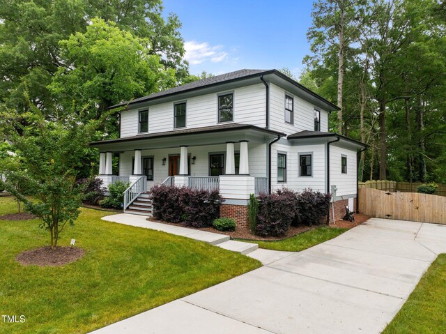 2551 Drake Ave, Durham, NC 27705 - view of front of home featuring covered porch, driveway, and a gate