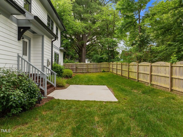 2551 Drake Ave, Durham, NC 27705 - fenced backyard with a patio area