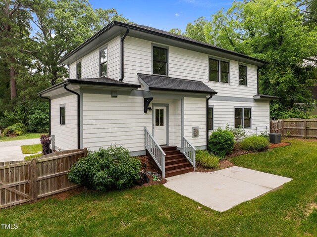 2551 Drake Ave, Durham, NC 27705 - back of property with entry steps and a patio