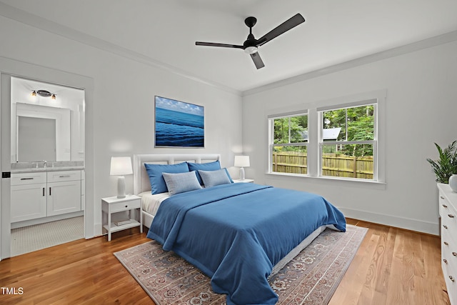 2551 Drake Ave, Durham, NC 27705 - bedroom featuring light wood-style floors, connected bathroom, ceiling fan, and ornamental molding