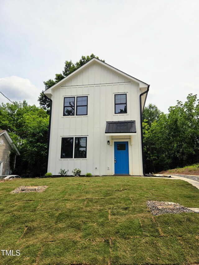 608A E Umstead, Durham, NC 27701 - modern farmhouse style home featuring board and batten siding and a front lawn
