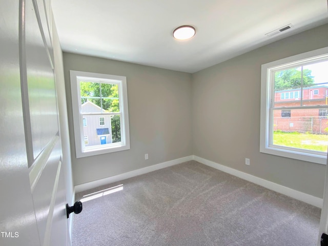608A E Umstead, Durham, NC 27701 - carpeted spare room featuring baseboards