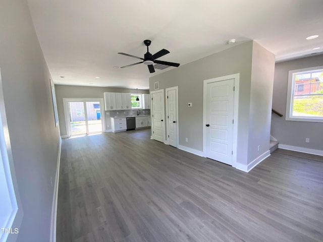 608A E Umstead, Durham, NC 27701 - unfurnished living room featuring plenty of natural light, dark wood-style flooring, ceiling fan, stairway, and recessed lighting