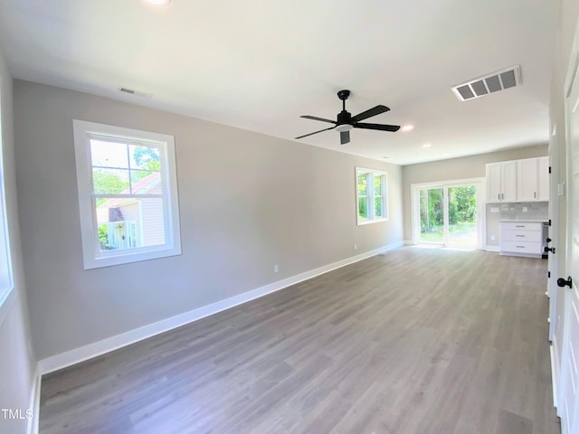608A E Umstead, Durham, NC 27701 - spare room featuring light wood-type flooring, a ceiling fan, and recessed lighting
