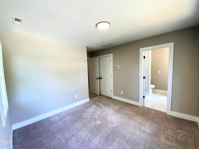 608A E Umstead, Durham, NC 27701 - unfurnished bedroom with carpet, a closet, and connected bathroom