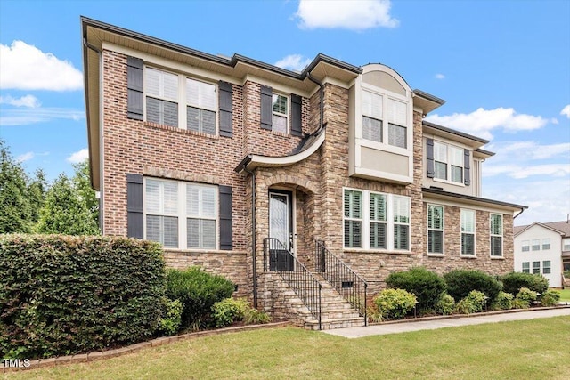 150 Saint Mellion St, Raleigh, NC 27603 - view of front of home with a front yard and stone siding
