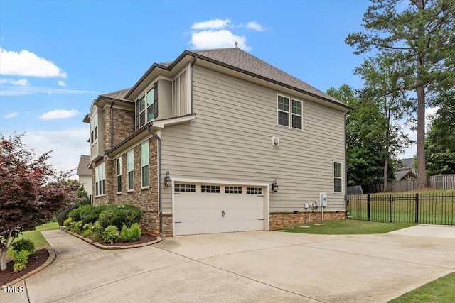150 Saint Mellion St, Raleigh, NC 27603 - view of side of home with concrete driveway, a garage, and stone siding